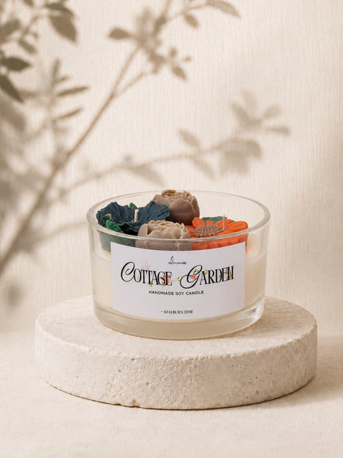 Cottage Garden handmade soy candle with colourful wax flowers in a glass jar