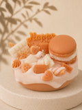 Cream Crush cake-inspired pillar candle decorated with cream and caramel-coloured wax sweets