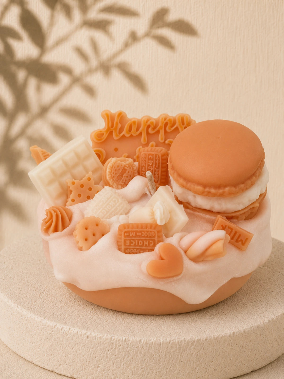 Cream Crush cake-inspired pillar candle decorated with cream and caramel-coloured wax sweets