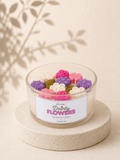 Dainty Flowers scented soy candle with colourful floral wax decoration in a clear glass jar