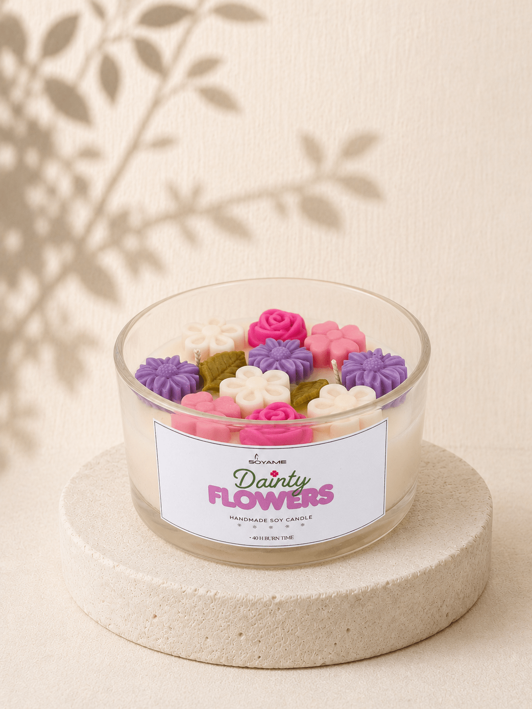 Dainty Flowers scented soy candle with colourful floral wax decoration in a clear glass jar