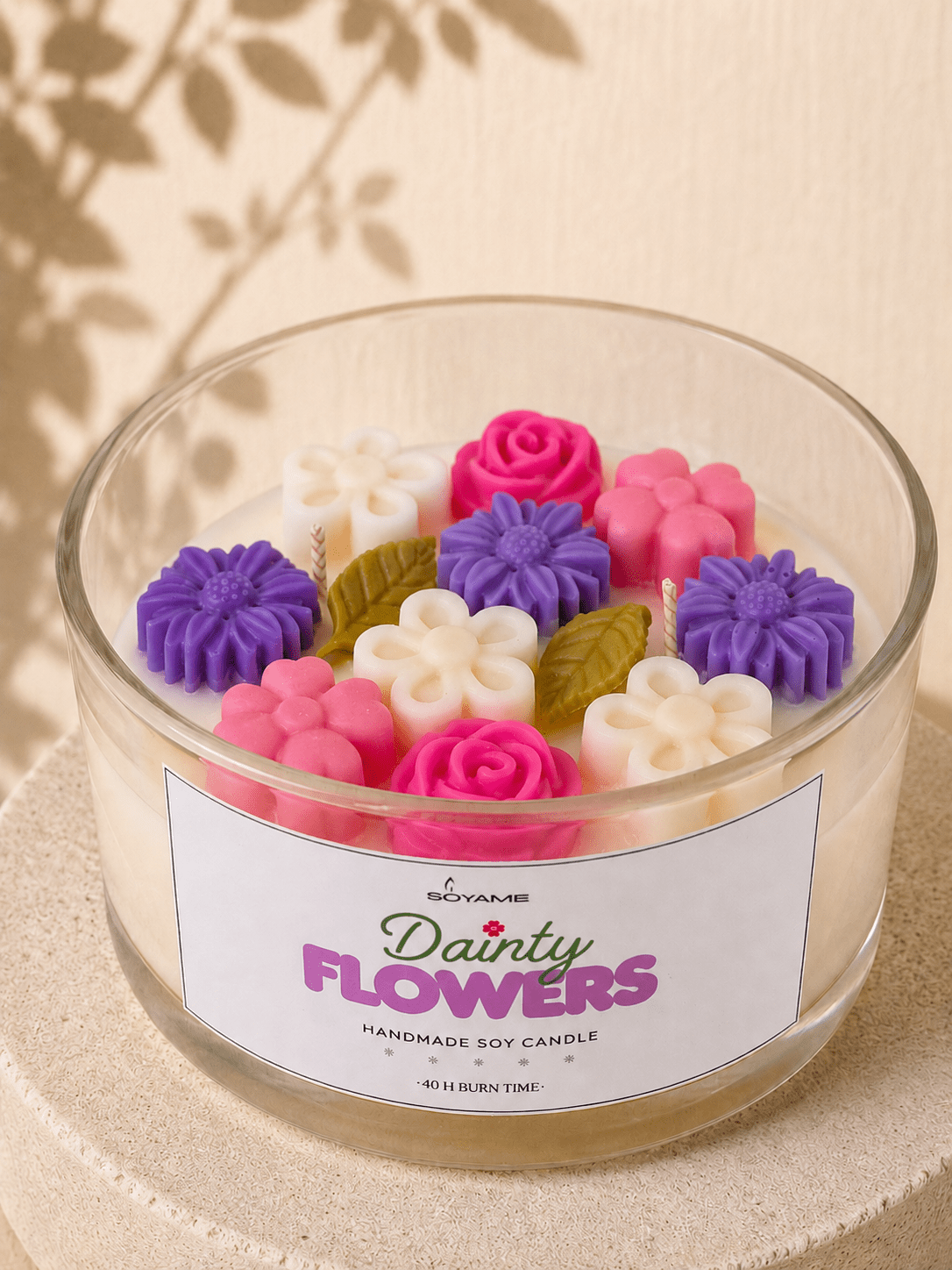 Close-up of Dainty Flowers scented soy candle with colourful floral wax decorations