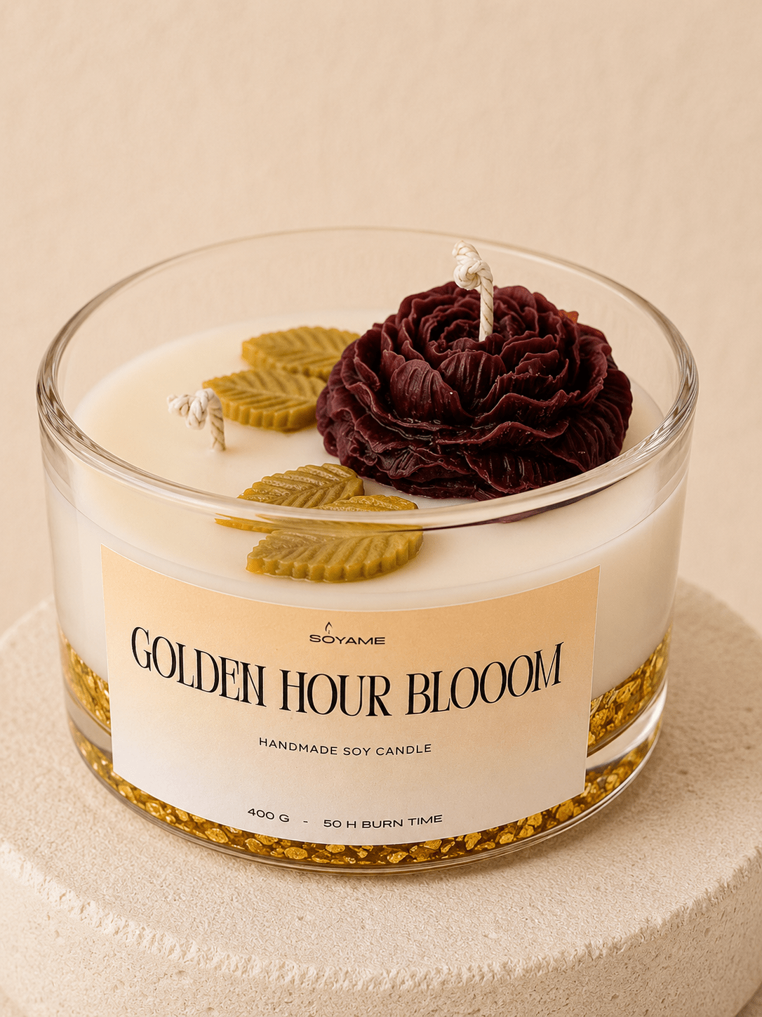 Close-up of the Golden Hour Bloom scented soy candle with floral wax details and gold-flecked gel wax base