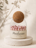 Pink Pearlescence handmade soy candle with pink wax pearls in a glass jar