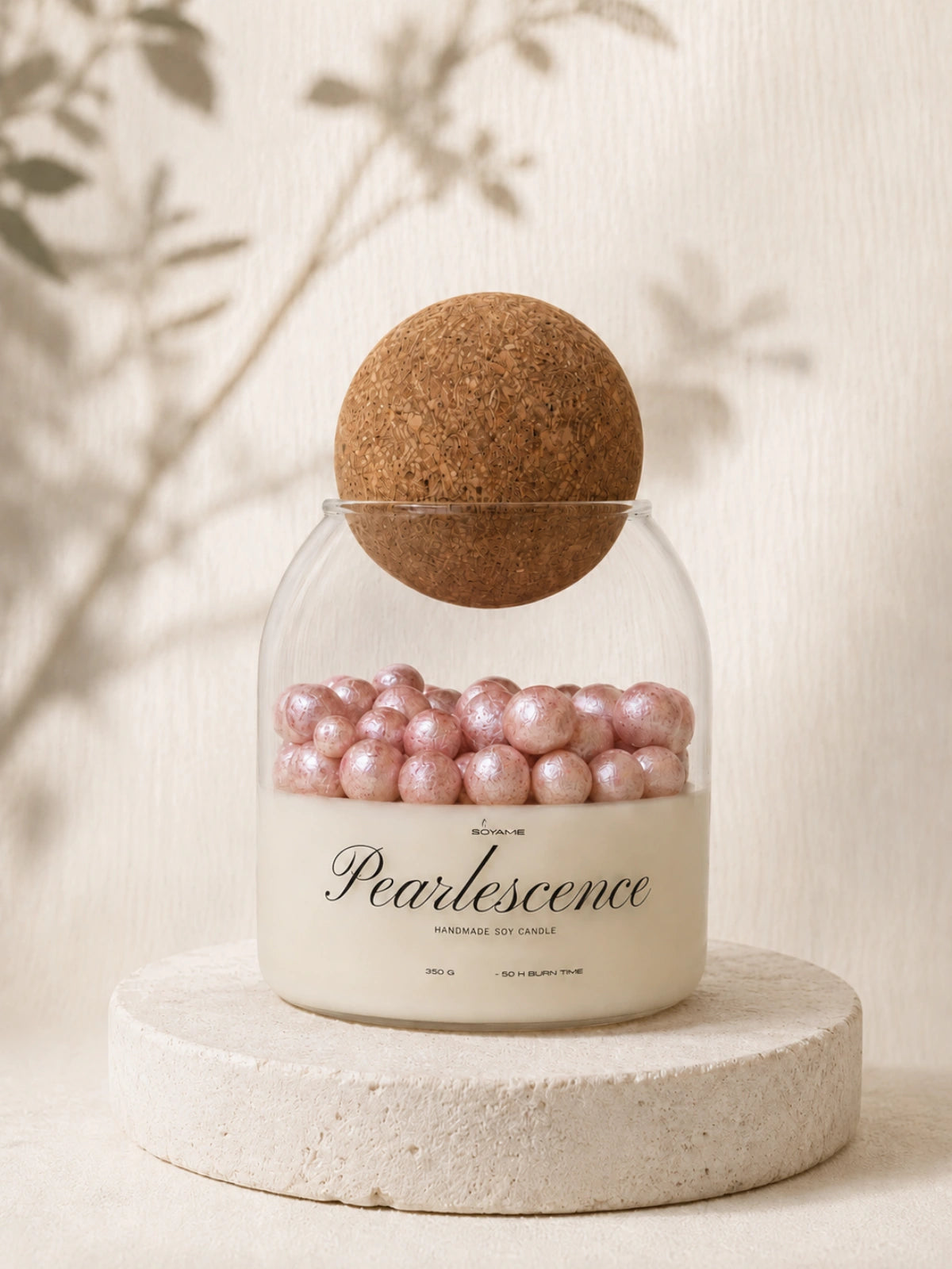 Pink Pearlescence handmade soy candle with pink wax pearls in a glass jar