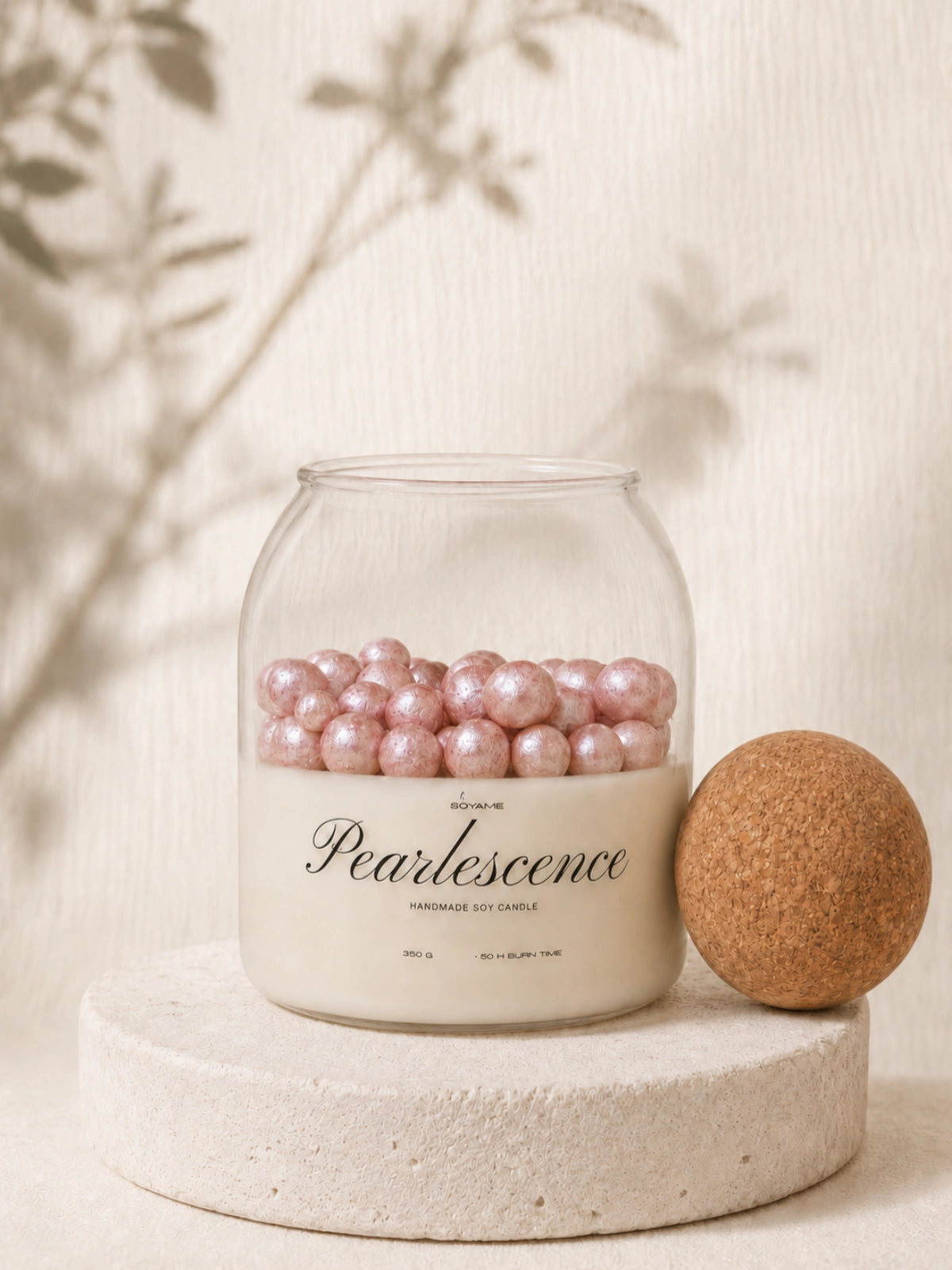 Pink Pearlescence soy candle with pink wax pearls and cork lid off