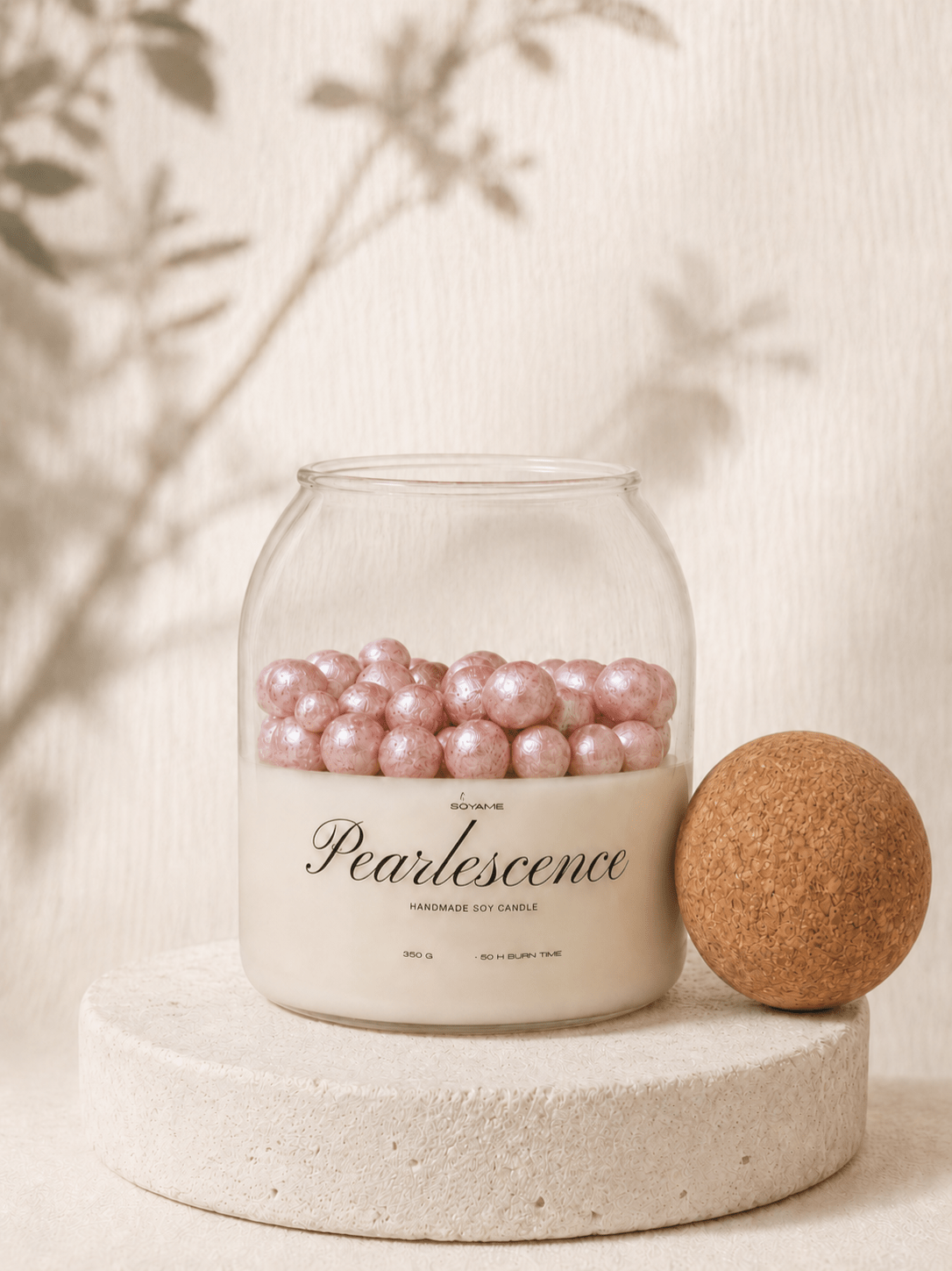 Pink Pearlescence scented soy candle by SOYAME with pink pearl wax details and lid removed