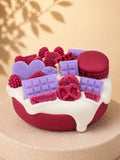 Red Velvet Crush cake-inspired pillar candle decorated with burgundy and purple wax sweets