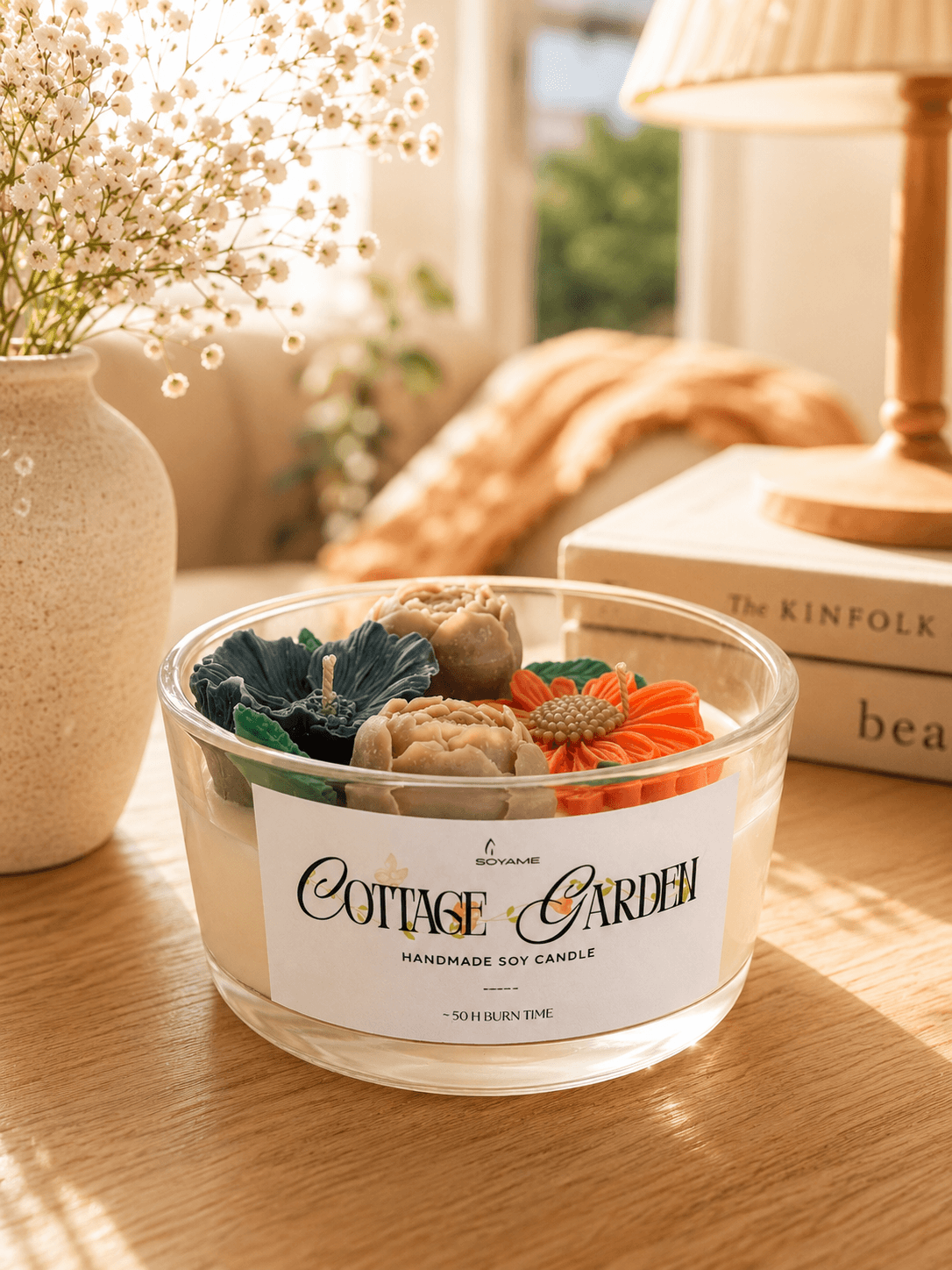 Cottage Garden scented soy candle by SOYAME styled in a warm home setting.