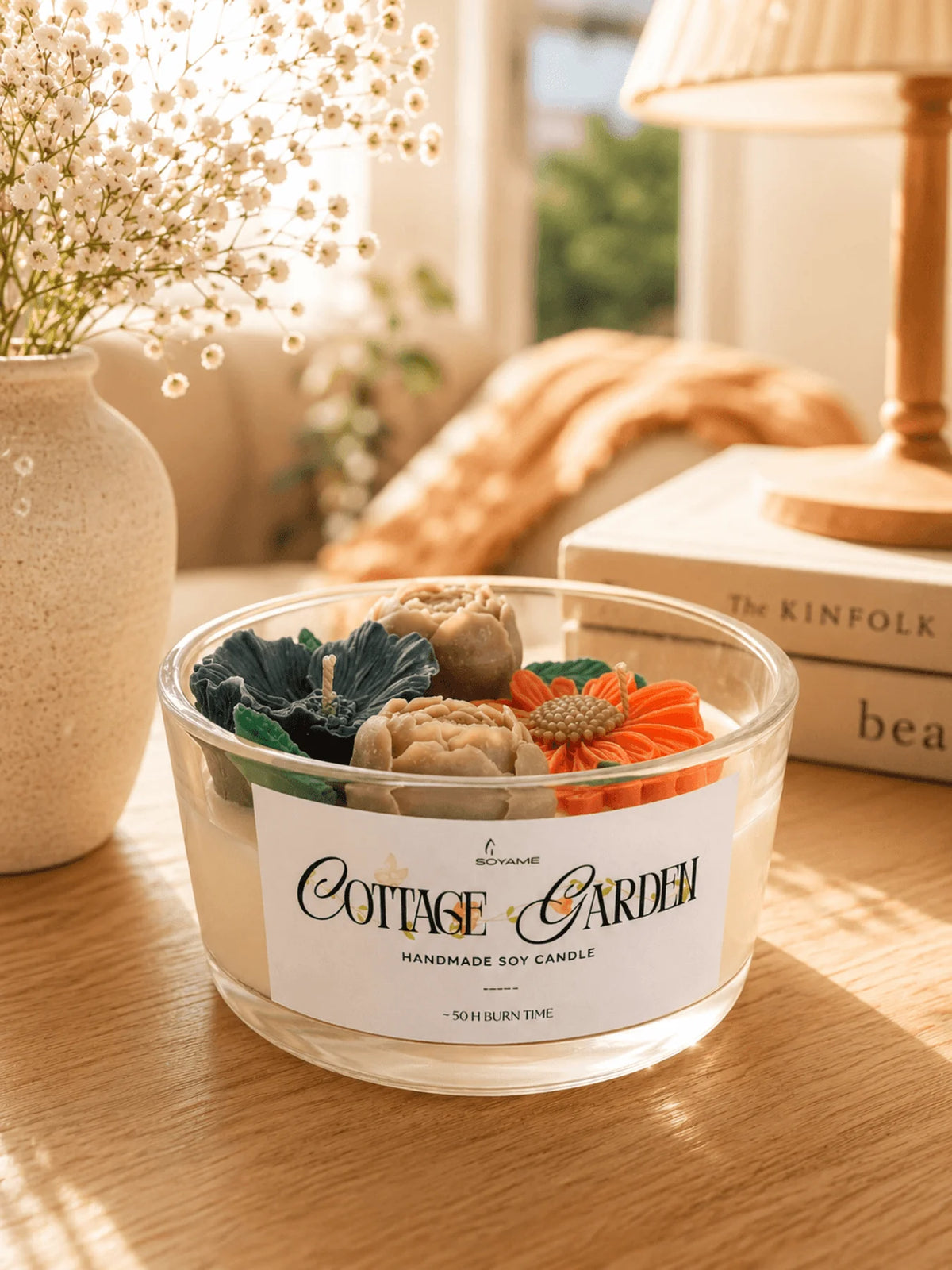 Cottage Garden scented soy candle by SOYAME styled in a warm home setting.
