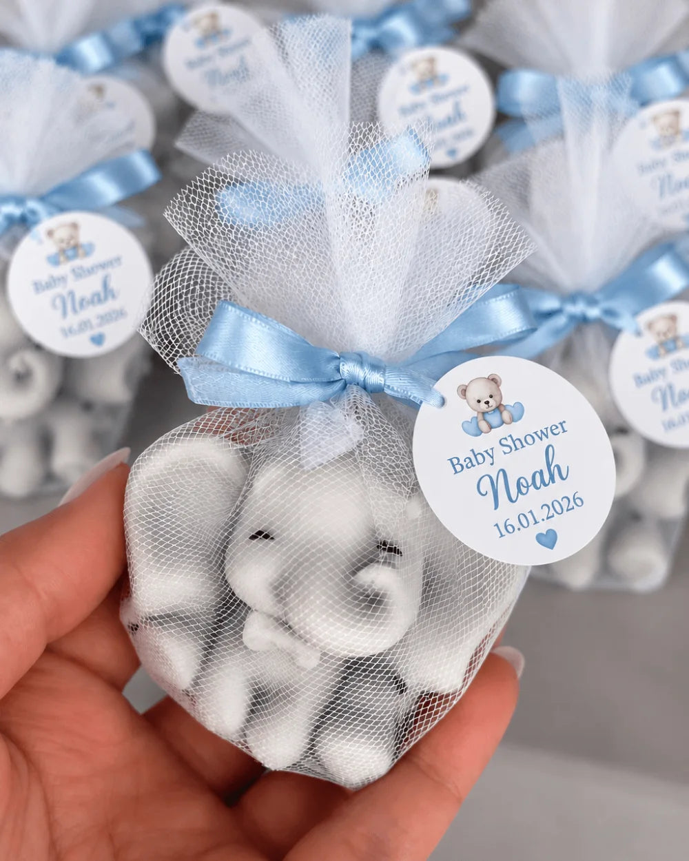 Grey cute elephant candle favour in tulle with blue ribbon and personalised baby shower tag