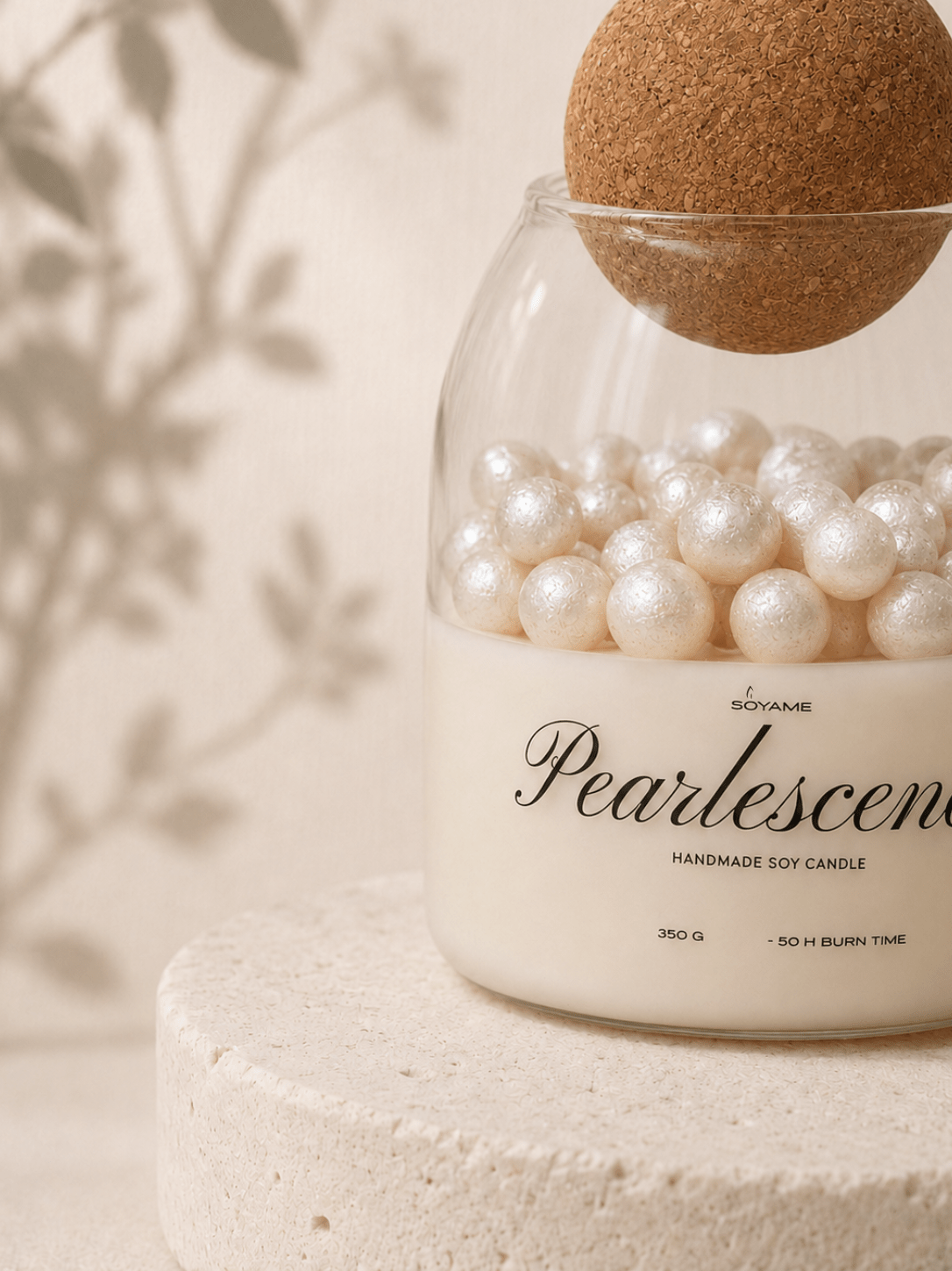 Close-up of White Pearlescence scented soy candle with decorative pearl wax details