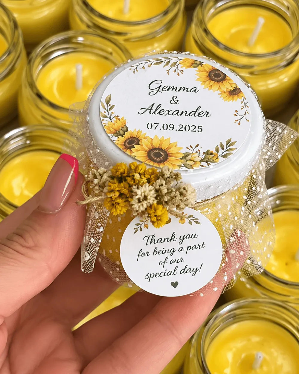 Yellow personalised wedding candle favour with sunflower labels and dried flower details