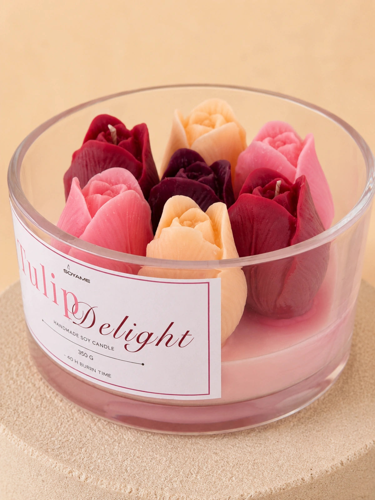 Close-up of the colourful tulip-shaped wax flowers of Tulip Delight candle