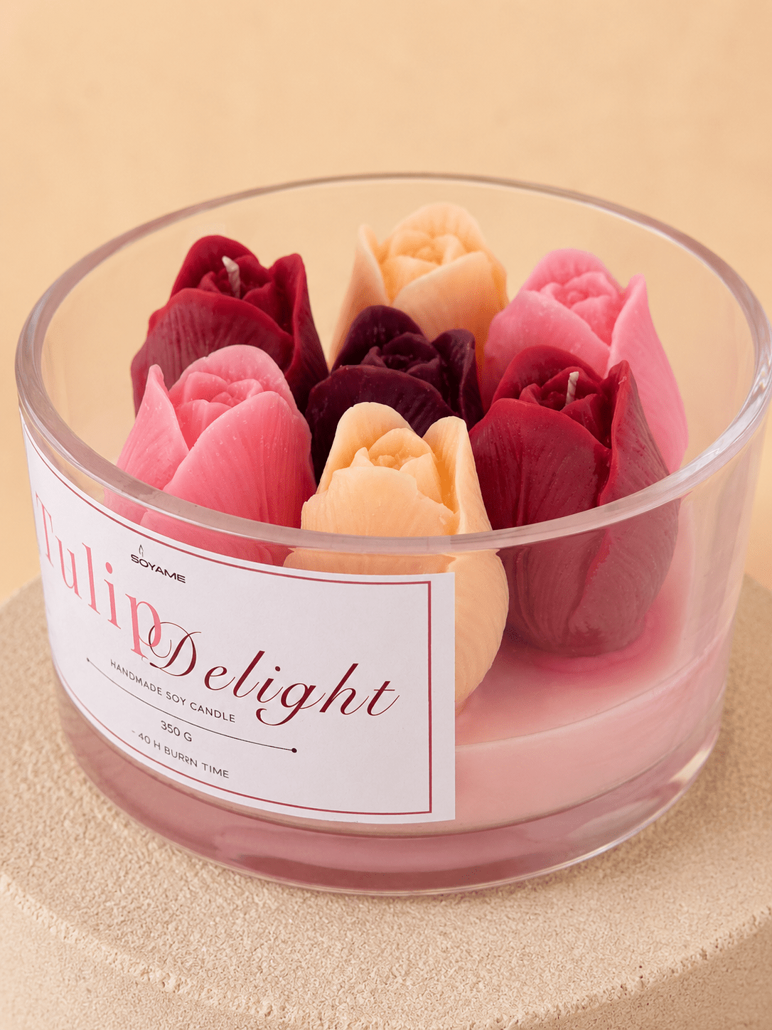 Close-up of Tulip Delight scented soy candle with colourful tulip wax flowers