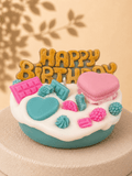 Turquoise Crush cake-style scented soy candle in turquoise and white with pink and blue sweet-inspired wax decoration